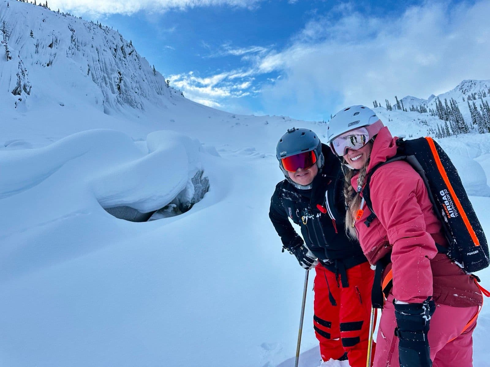 Two CMH guests on a snowy slope in British Columbia