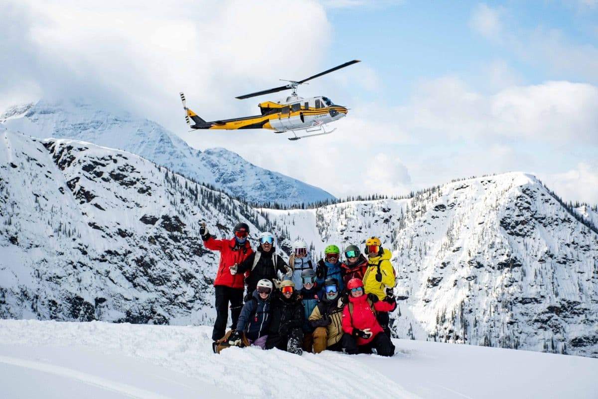 A guided group descends together on a CMH heli-ski trip