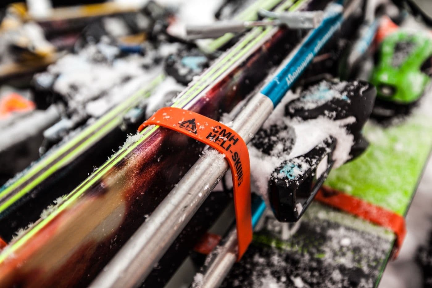 Skis racked with a CMH Heli-Skiing strap, ready for the day